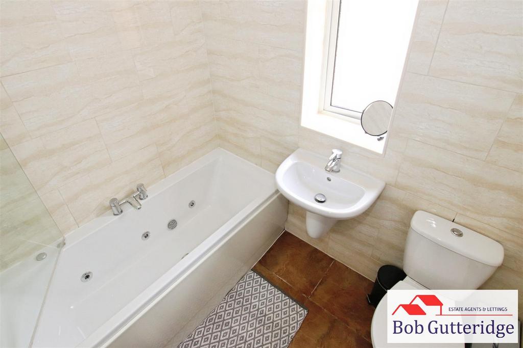 First floor fully tiled bathroom