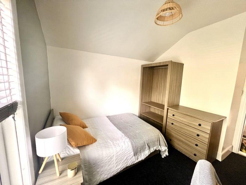 Bright and inviting double bedroom featuring a ...