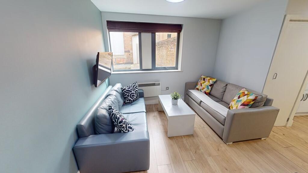 A modern living room featuring two comfortable ...