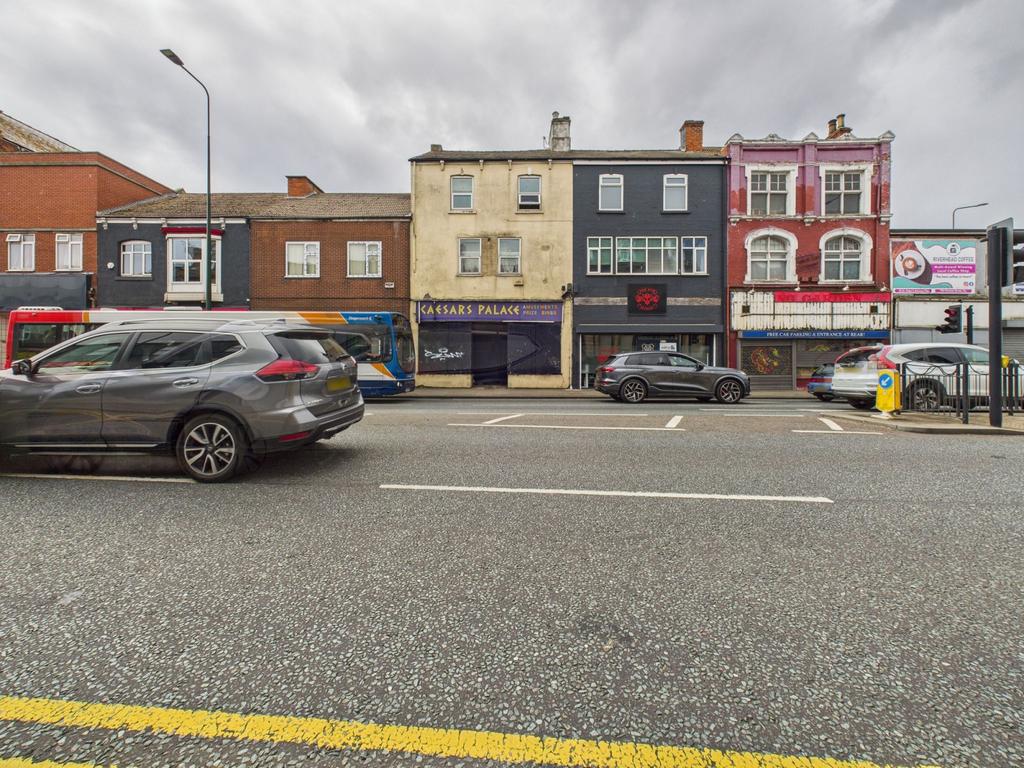 Ground floor retail space with three flats above
