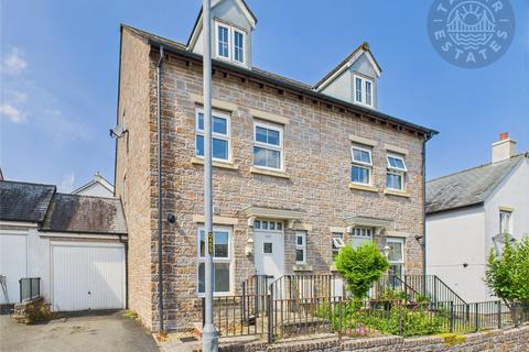 “A modern three-storey townhouse with garage, offering style and convenience in equal measure.”