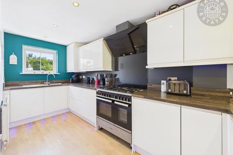 undefined, “A modern three-storey townhouse with garage, offering style and convenience in equal measure.”