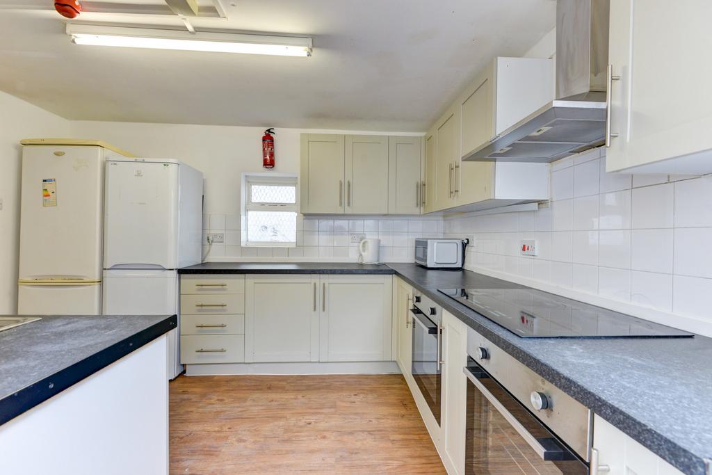 A bright and modern kitchen with ample counter ...