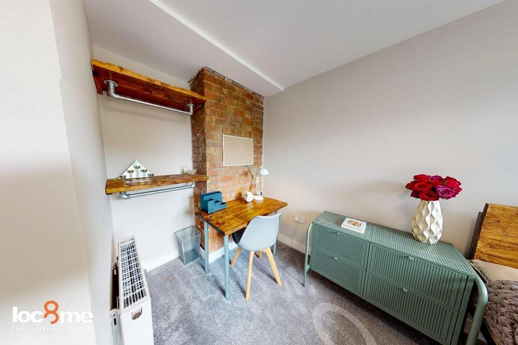 A stylish and inviting double bedroom featuring...