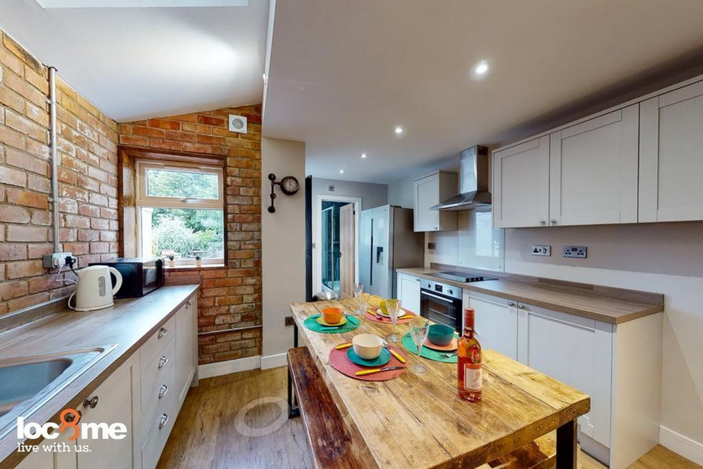 A bright and spacious kitchen featuring modern ...