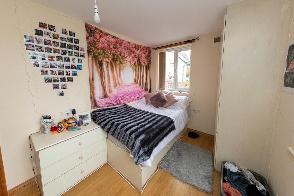 Bright and cozy bedroom featuring a single bed ...