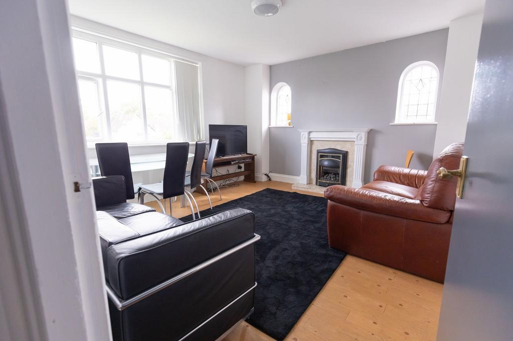 Bright and welcoming living room with large win...