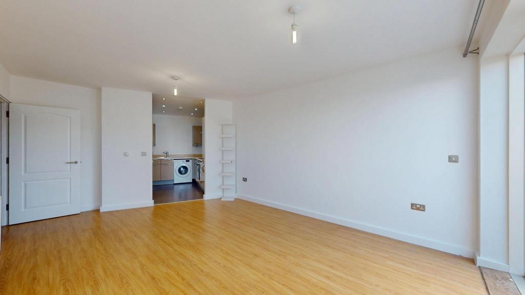 Bright and spacious living room featuring warm ...