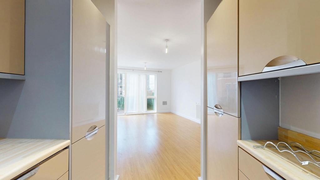 Bright and inviting living room with ample natu...