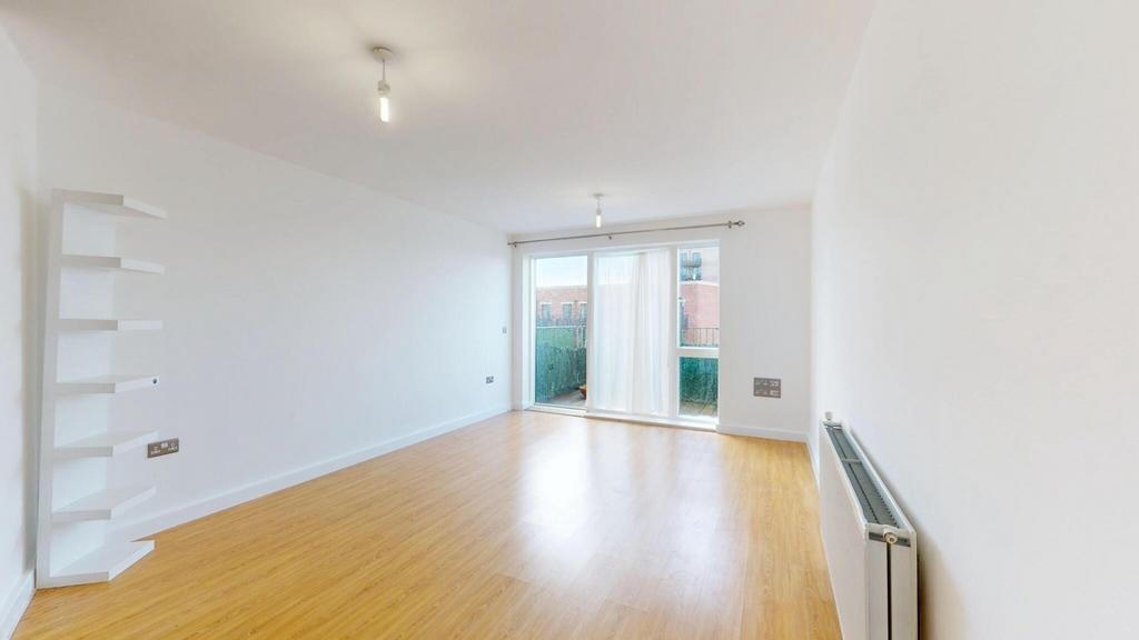 Bright and spacious living room with warm woode...
