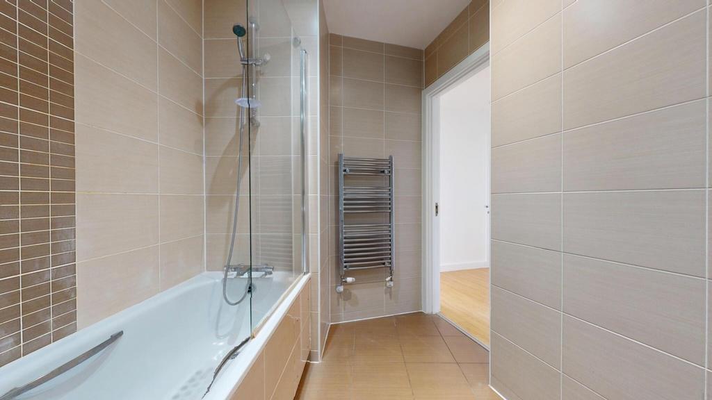 A modern and well-maintained bathroom suite fea...