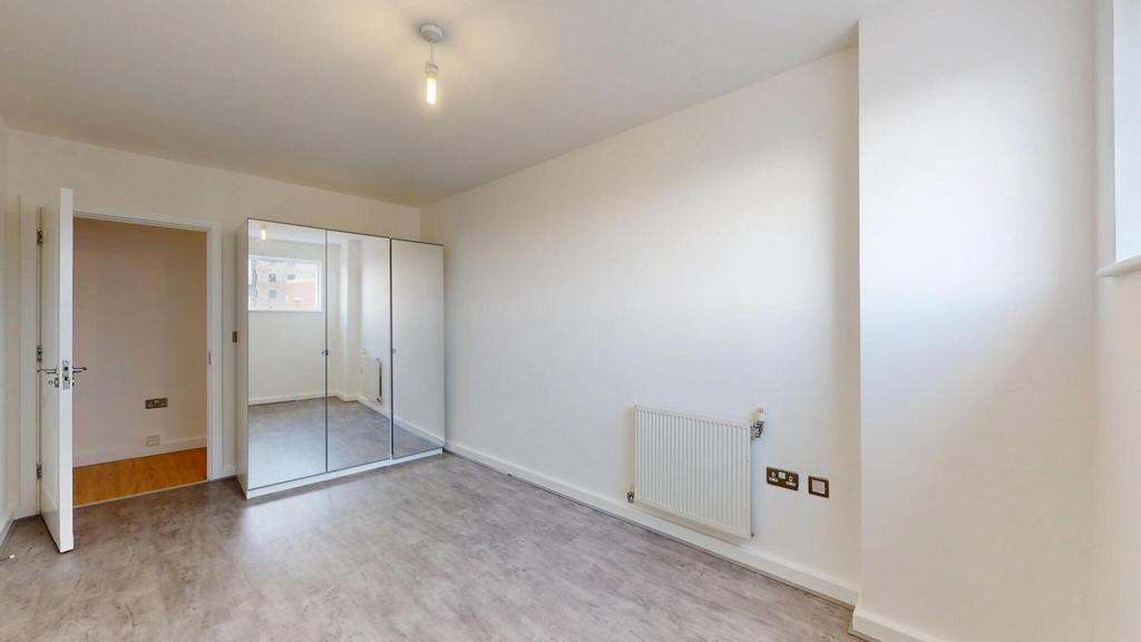 Bright and clean double bedroom featuring neutr...