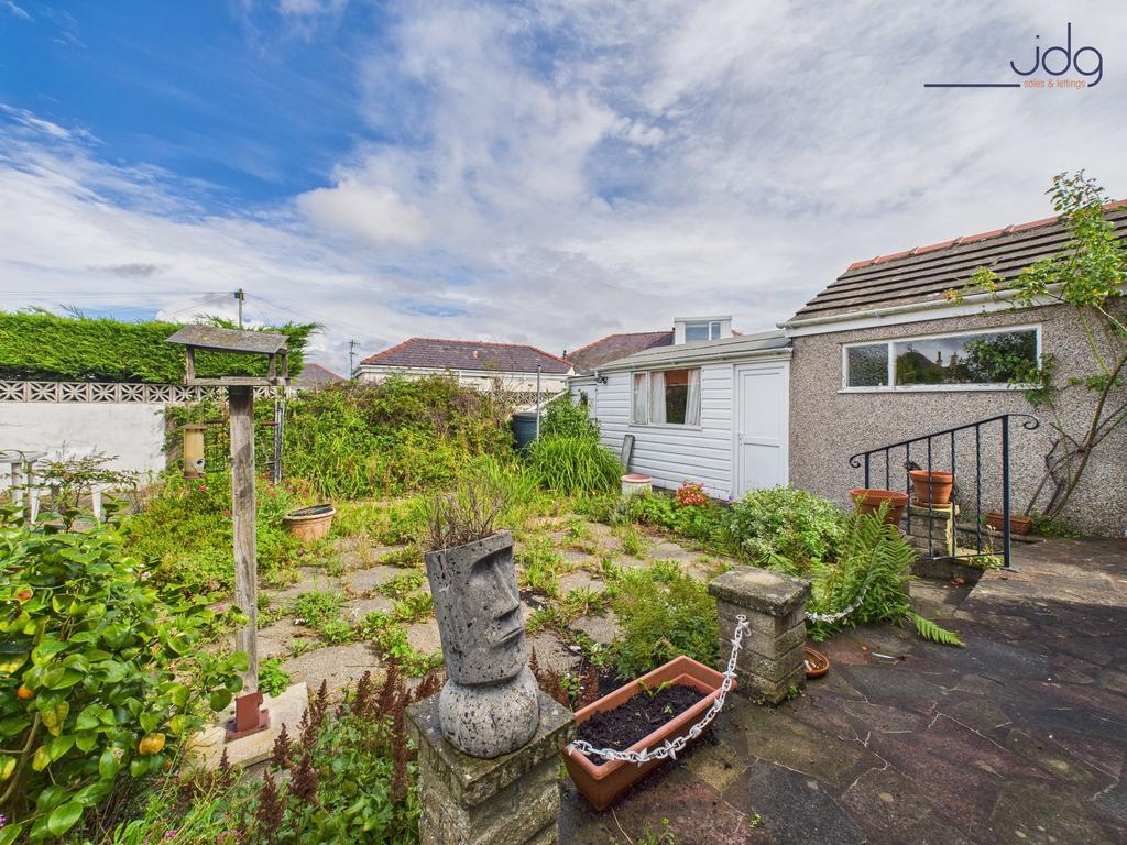 Flagged Garden with Entrance to the Detached...
