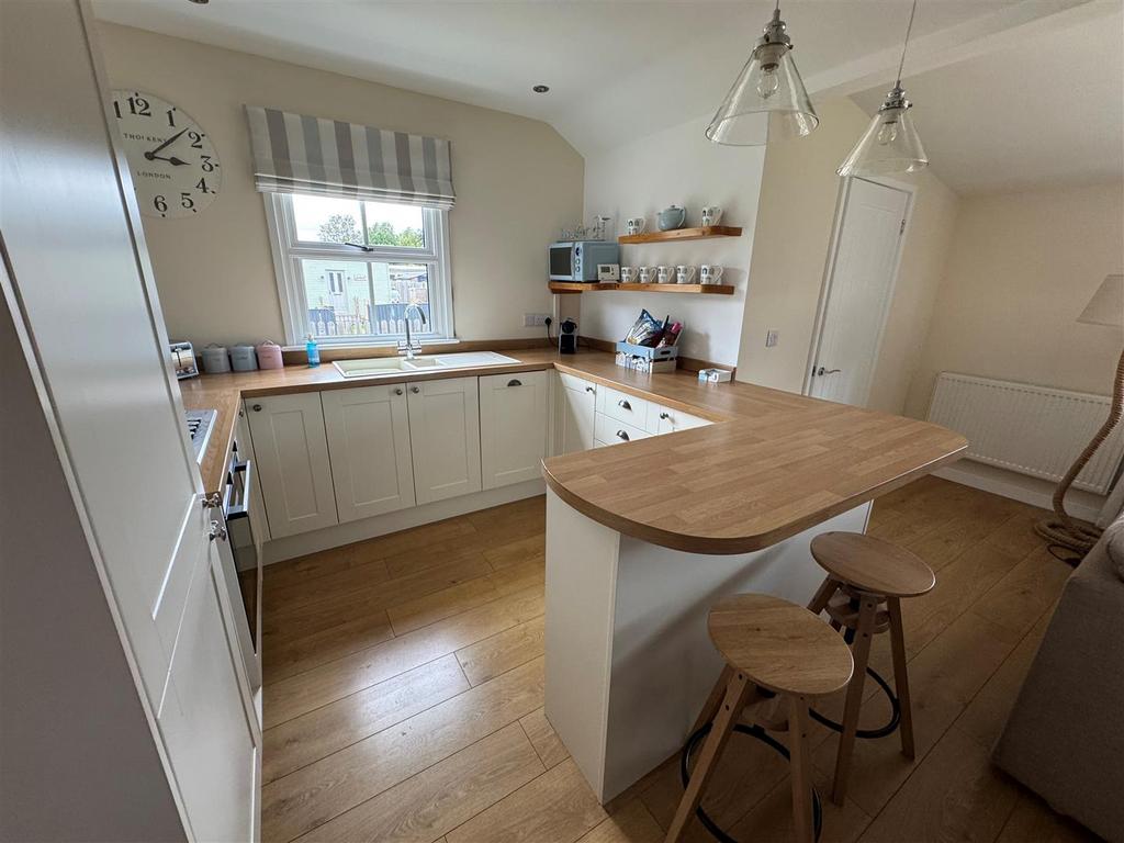 Living area, sitting, dining and kitchen