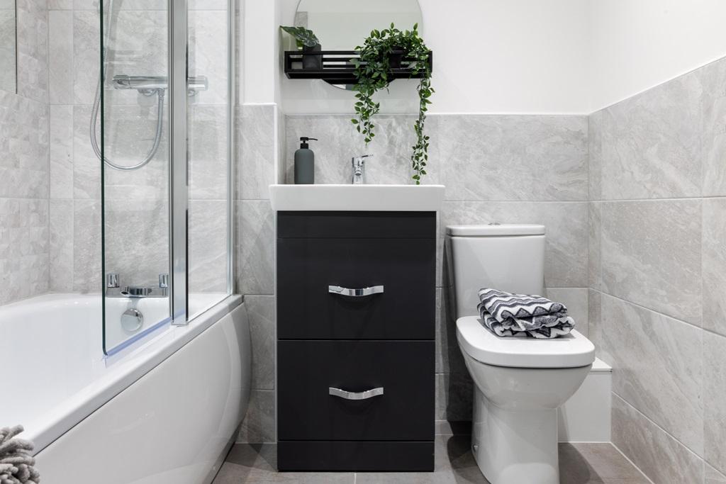 Family-friendly bathroom with shower over bath