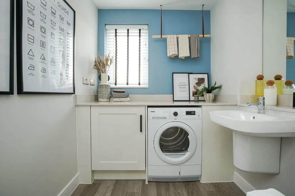 Downstairs there's a combined cloakroom/utility