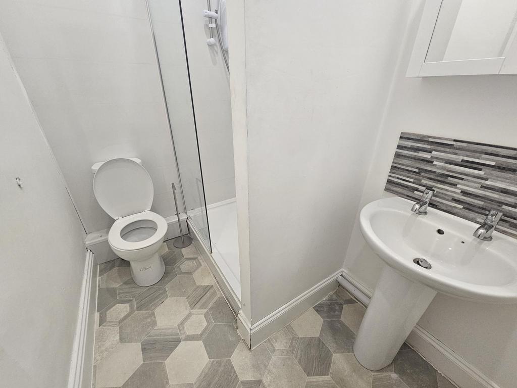Modern and clean bathroom with a spacious showe...