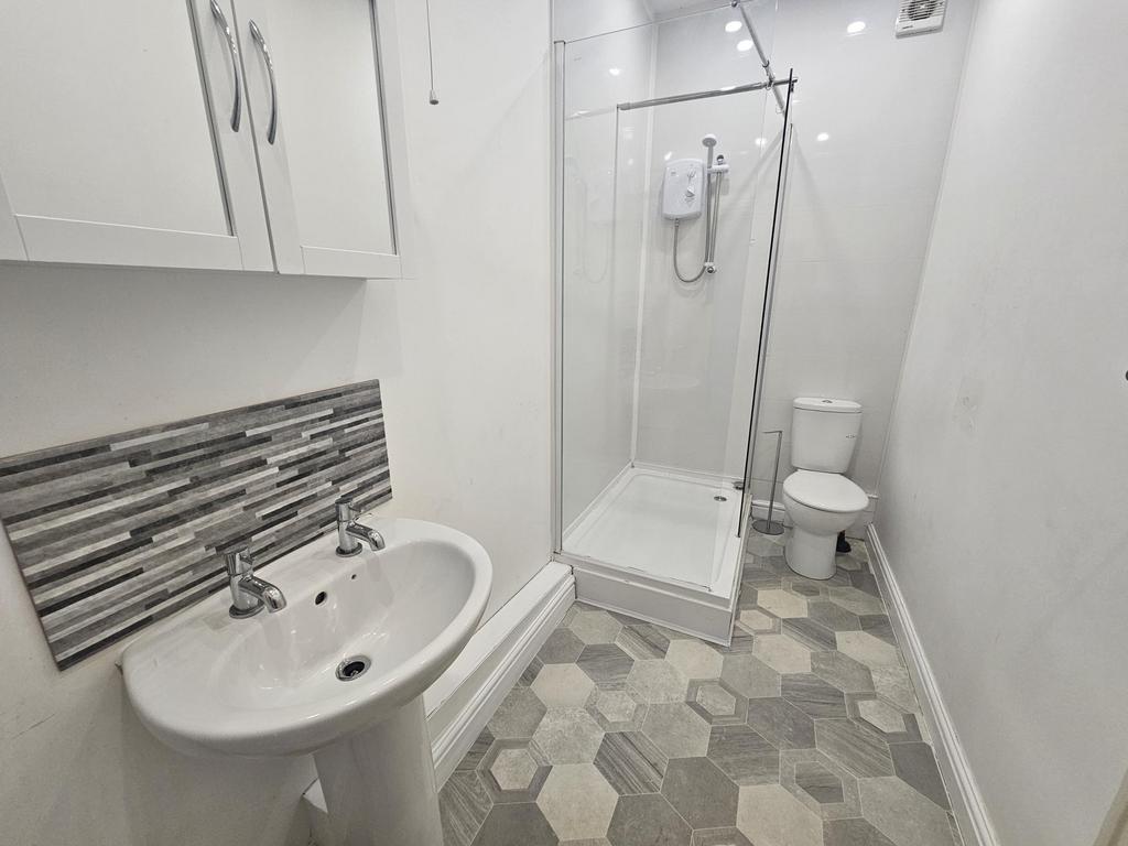 A clean and well-maintained bathroom featuring ...