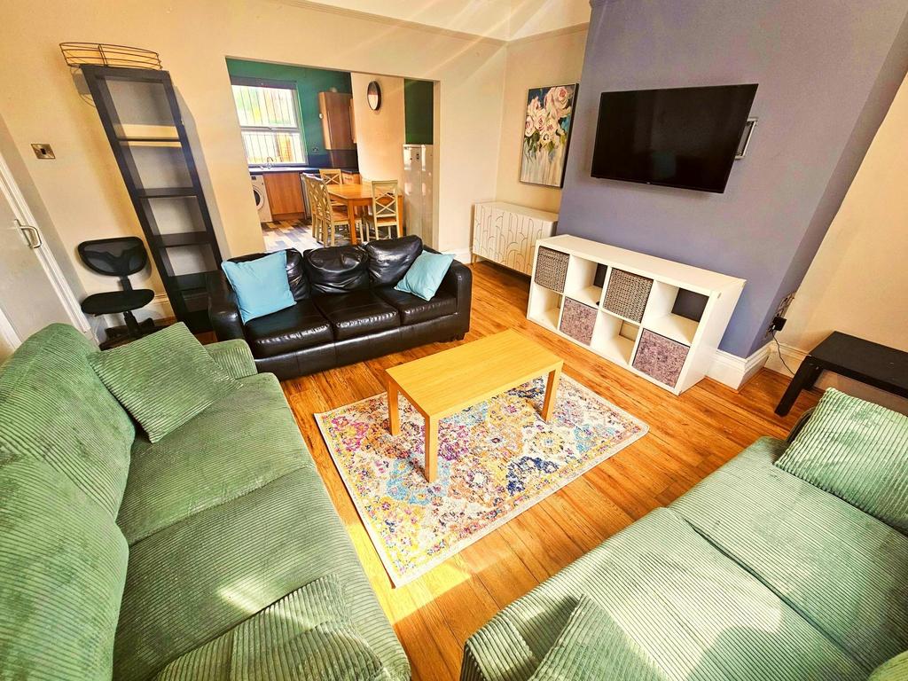 Bright and inviting living room featuring conte...