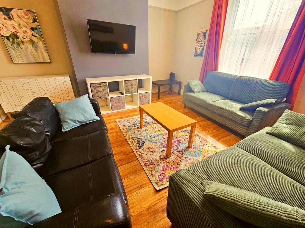 Bright and inviting living room featuring comfo...
