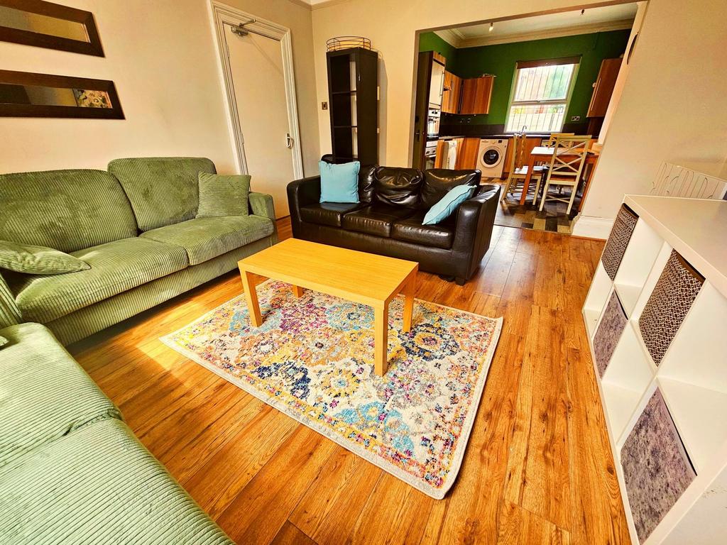 A cozy and inviting living room featuring comfo...