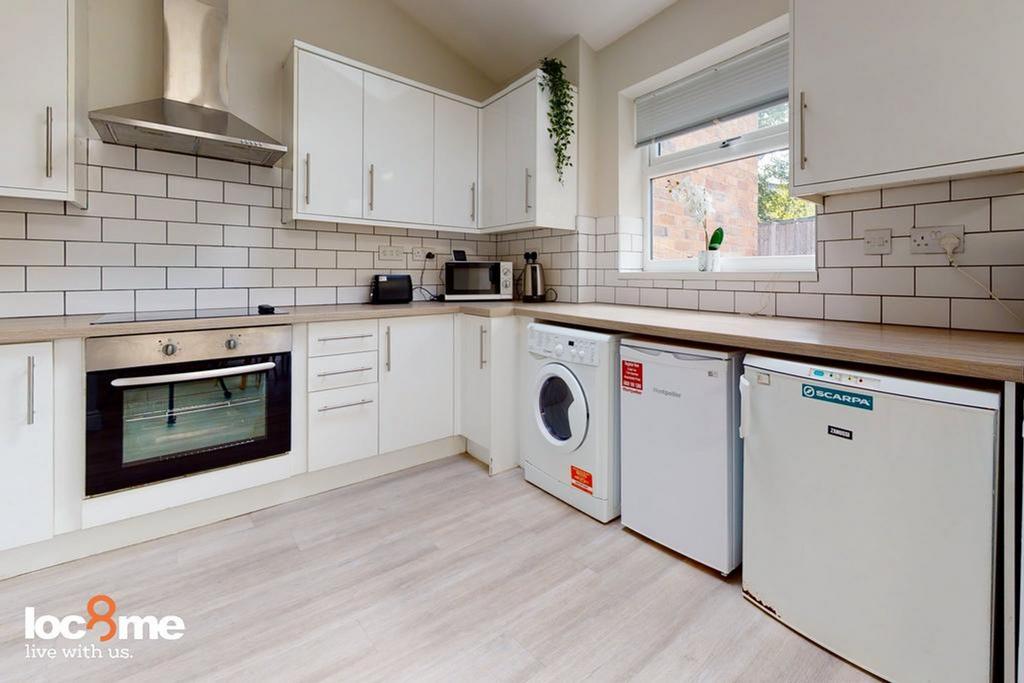 A modern and clean kitchen with ample space and...
