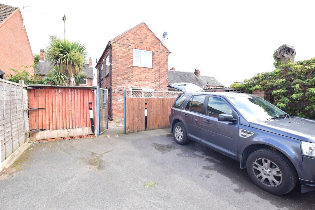 Rear view of house and parking