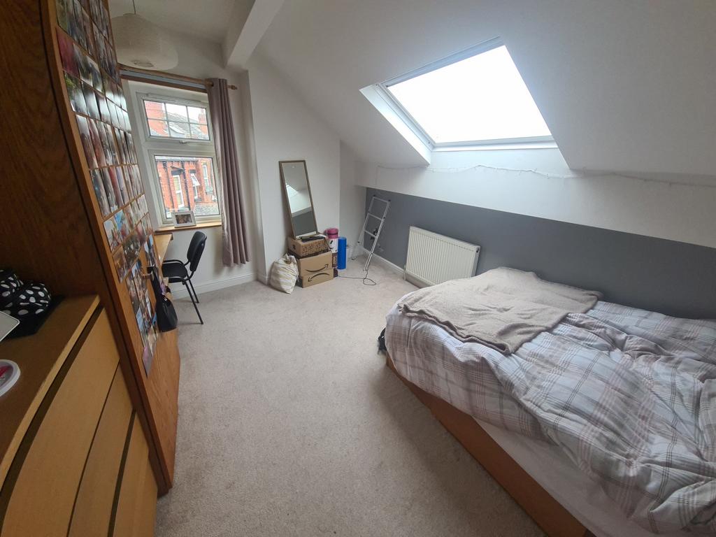 A bright and inviting double bedroom featuring ...