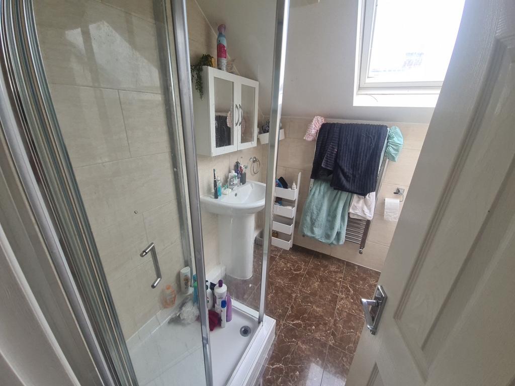 A clean and modern bathroom featuring a glass s...