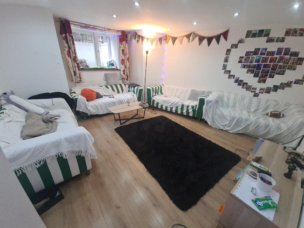 Bright and inviting communal lounge featuring m...