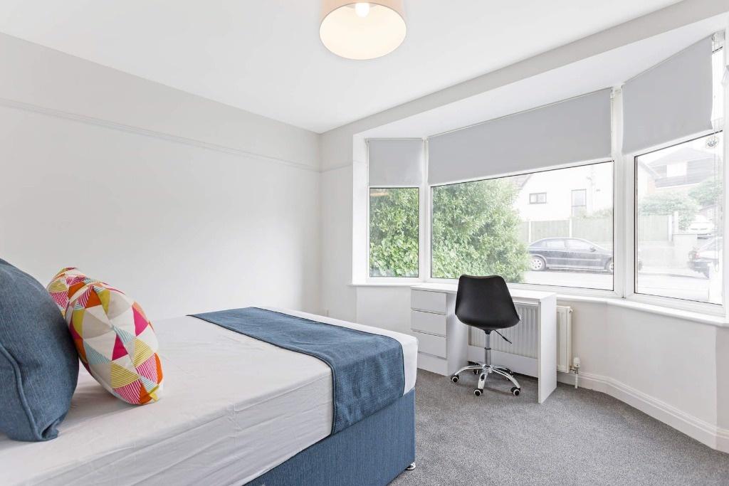 Bright and airy double bedroom featuring a comf...