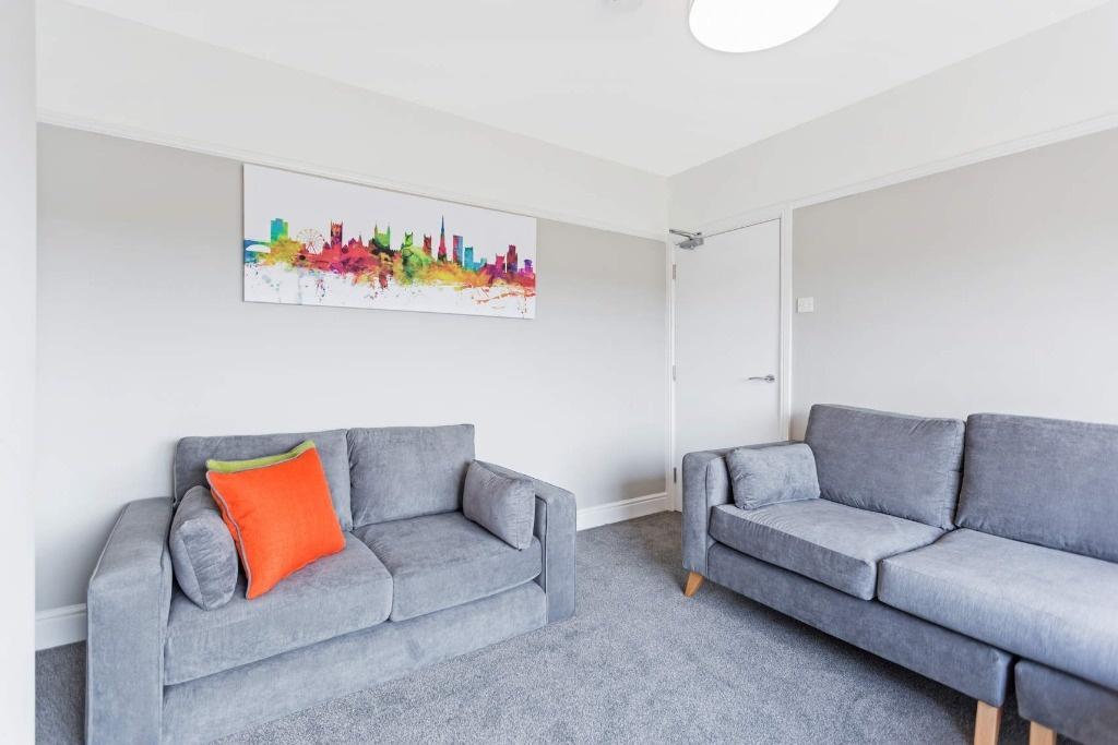 A modern living room featuring two comfortable ...