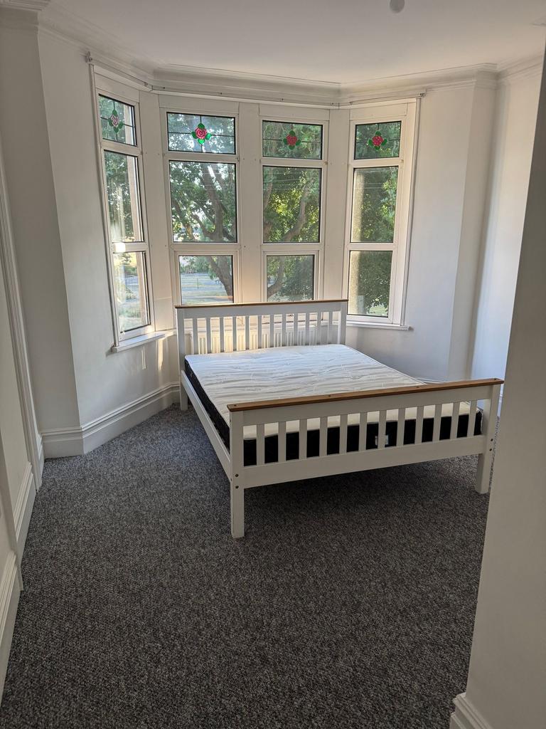 Bright and inviting double bedroom featuring a ...