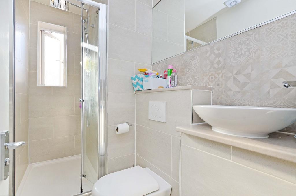 Bright and modern bathroom featuring a sleek wa...