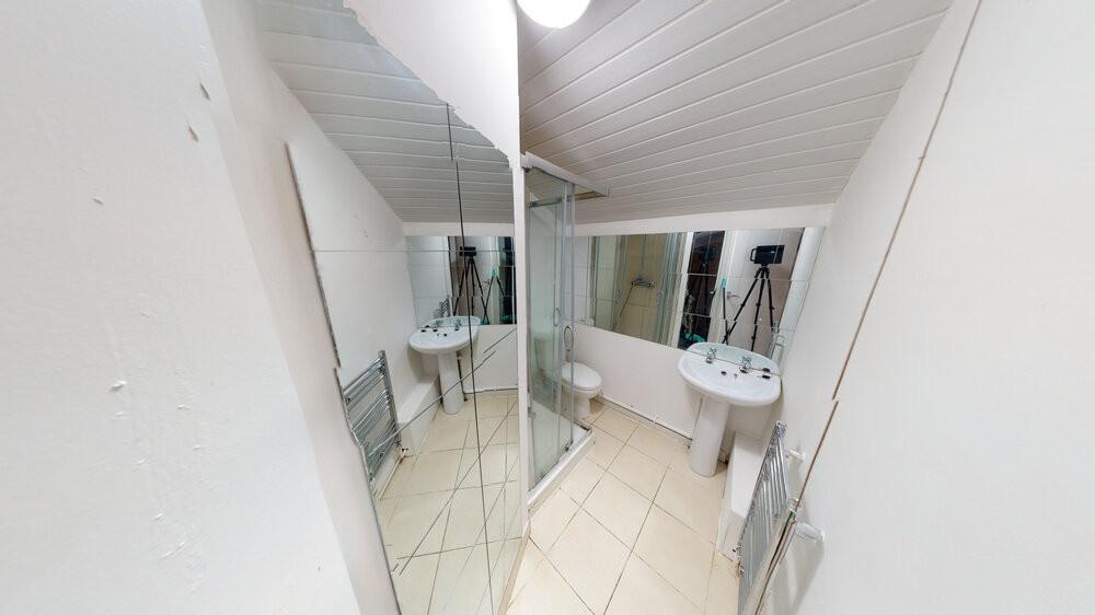 Bright and clean bathroom featuring a modern si...