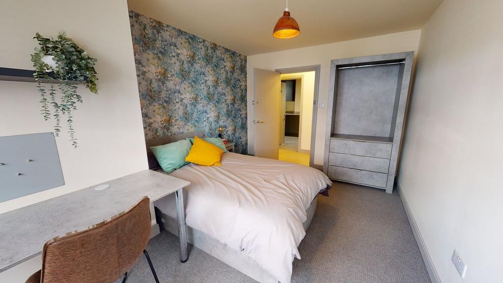 A bright, well-maintained double bedroom featur...