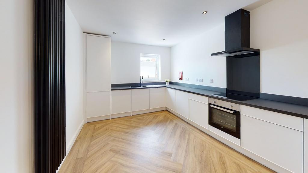 Modern and sleek kitchen with ample counter spa...