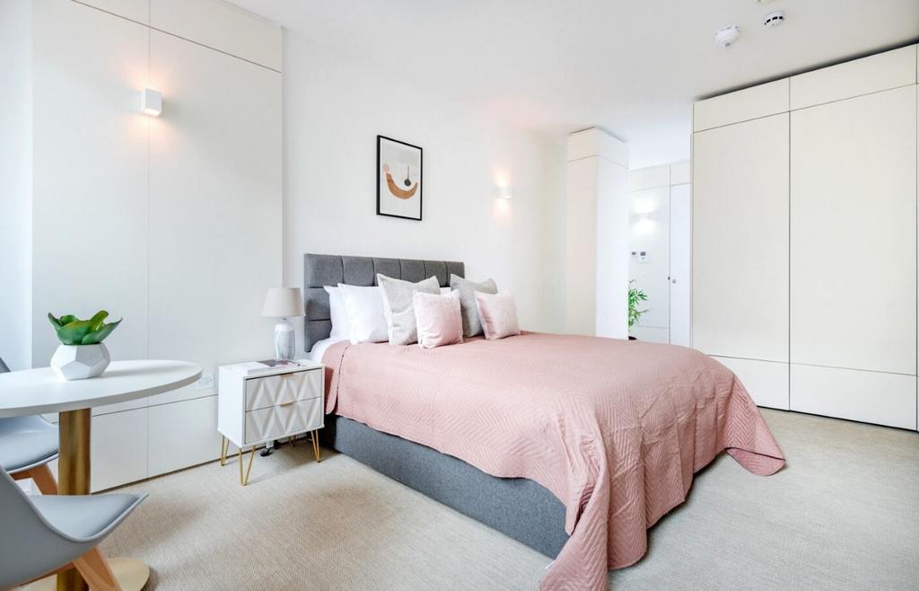 A spacious and bright large double bedroom with...