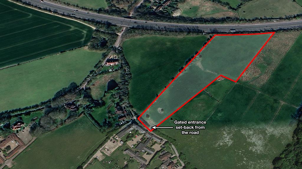 Land for sale on an affluent residential road.