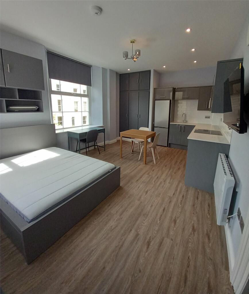 Bright and spacious master bedroom with modern ...