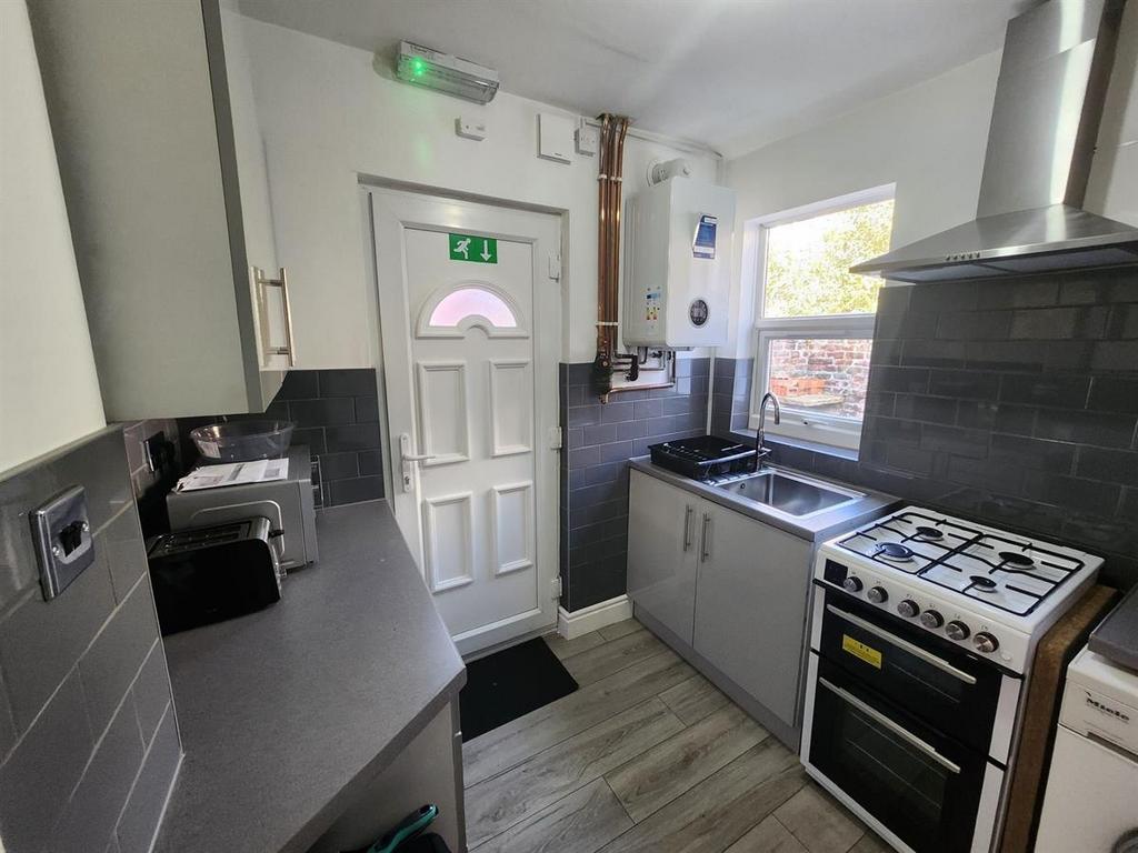 A modern, well-lit kitchen with clean surfaces,...