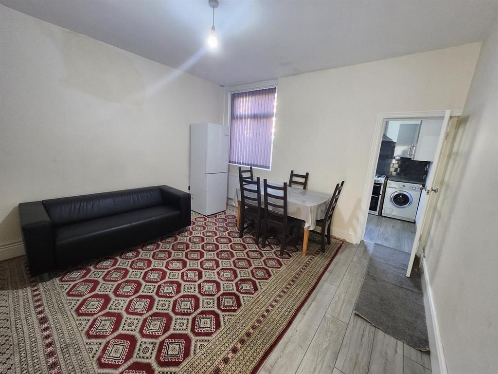 A bright and welcoming living room featuring a ...