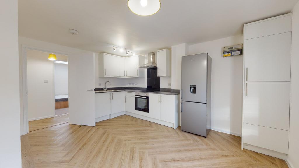 Bright and modern kitchen with white cabinets, ...