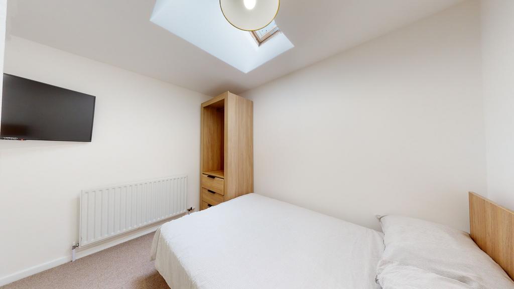 Bright and minimalistic bedroom featuring a sky...