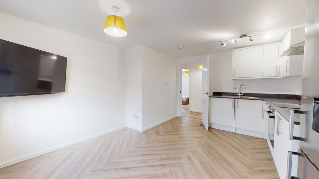 Bright, modern living area with ample natural l...