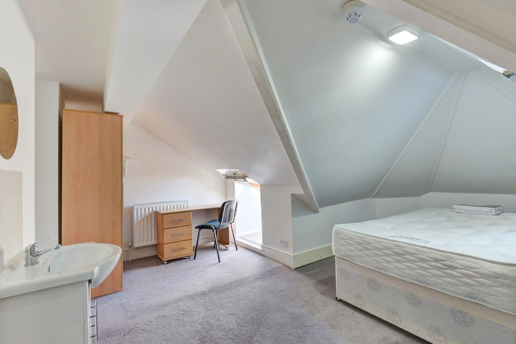 Bright and inviting attic master bedroom featur...
