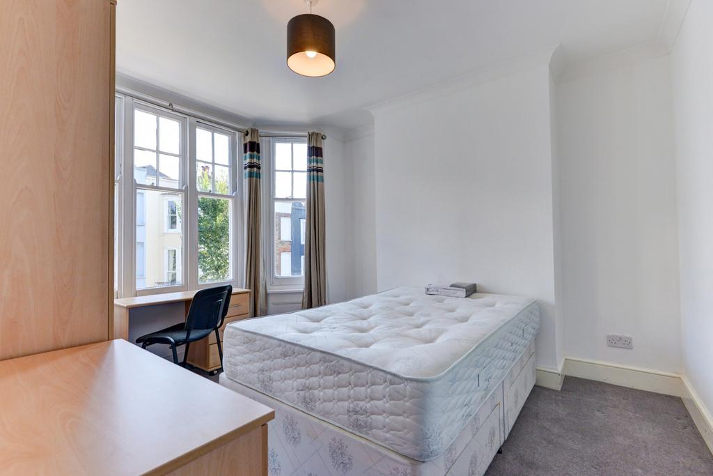 Bright and airy double bedroom featuring a larg...