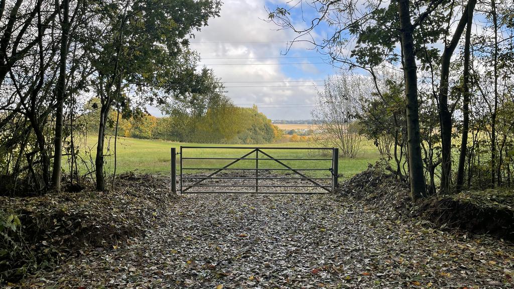 Direct gated access set-back from the road.