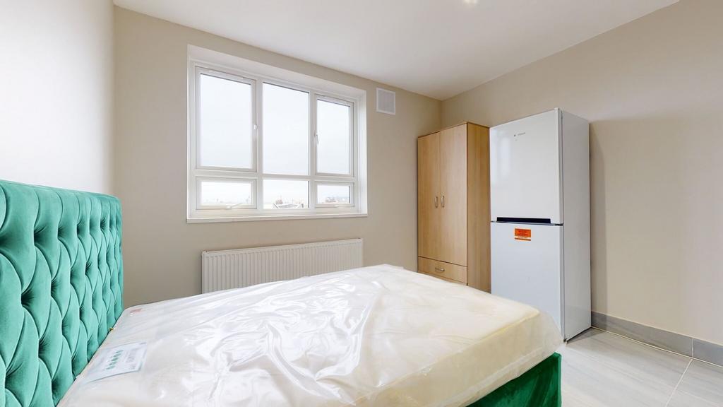 Bright and inviting master bedroom with a bold ...