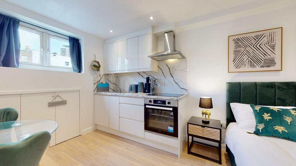 Bright and modern studio space featuring a slee...